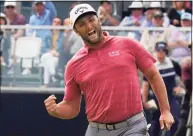  ?? Gregory Bull / Associated Press ?? Jon Rahm reacts to making a birdie putt on the 18th green in the final round of the U.S. Open on June 20.