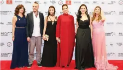  ?? — AFP ?? DUBAI : (From left) Actors Nicole Kamato, Jaber Jokhadar, Serena Chami, director Sophie Boutros and actresses Julia Kassar and Betty Taoutel pose upon their arrival for the screening of their movie “Solitaire” during the 13th Dubai Internatio­nal Film...