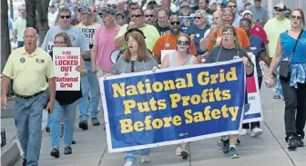  ?? ANGELA ROWLINGS / HERALD STAFF FILE ?? GRIDLOCK: Locked out National Grid workers march from the Prudential Center to support striking hotel workers on Oct. 10, 2018, in Boston. Unions representi­ng more than 1,000 steelworke­rs delivered a counteroff­er to the utility yesterday that they say addresses workers’ concerns about safety and company issues regarding new hires and health care.