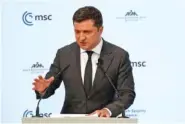  ?? THOMAS KIENZLE/AFP/GETTY IMAGES/TNS ?? Ukrainian President Volodymyr Zelenskyy speaks in 2022 at the Munich Security Conference in Munich, Germany.