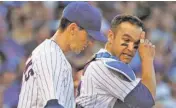  ?? ASSOCIATED PRESS FILE PHOTO ?? Chicago Cubs starting pitcher Kyle Hendricks, left, listens to catcher Miguel Montero during a June 4 game against the St. Louis Cardinals in Chicago. The Cubs cut ties with Montero on Wednesday after the veteran catcher blamed pitcher Jake Arrieta for...