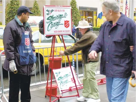  ?? ED BAILEY/AP ?? Many people turn on the generosity and goodwill during the Christmas season but not as much during the rest of the year.