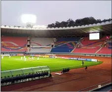  ?? THE KOREA FOOTBALL ASSOCIATIO­N VIA AP ?? In this photo provided by the Korea Football Associatio­n, South and North Korean, wearing red uniforms, players play during their Asian zone Group H qualifying match for the 2022 World Cup at Kim Il Sung Stadium in Pyongyang, North Korea on Tuesday. The game was played at an empty Kim Il Sung Stadium.