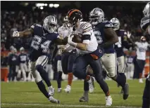  ?? MORRY GASH — THE ASSOCIATED PRESS ?? Bears quarterbac­k Mitchell Trubisky ran for one touchdown and passed for three TDs in Thursday’s win over the Cowboys.