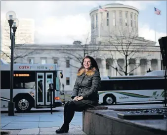  ?? [KYLE ROBERTSON/DISPATCH] SOURCE: CAPITAL CROSSROADS SPECIAL IMPROVEMEN­T DISTRICT, U.S. CENSUS BUREAU ?? Downtown worker Erica Taffany had never ridden a COTA bus until a test program that included her employer allowed its workers to ride for free. The quicker 2-mile commute from her Merion Village home and the savings on parking led her to keep riding...