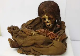  ?? AP Photo/Juan Karita ?? ■ In this Aug. 15 photo, the 500-year-old mummy of an Incan girl sits inside a vault at the National Museum of Archaeolog­y in La Paz, Bolivia. Nicknamed Nusta, a Quechua word for “Princess,” the mummy recently returned to its native Bolivia 129 years after it was donated to the Michigan State University museum in 1890.