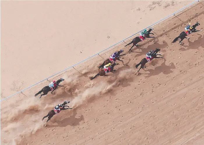  ?? Main picture: PETER WALLIS ?? AND RACING: The field takes off at the Birdsville races (main) and Danny Griffin, with wife Jana and daughter Ayla (inset), will make the 1600km trip to race at the iconic carnival.