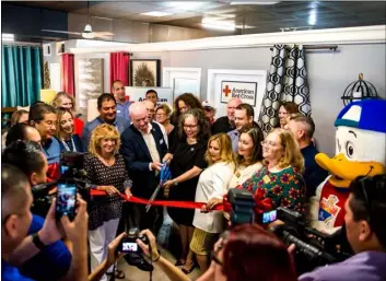  ?? PHOTO VINCENT OSUNA ?? Community members and local officials participat­e in a ribbon cutting ceremony Thursday morning to unveil the Red Cross’s new El Centro location inside Furniture Palace on Main Street in El Centro.