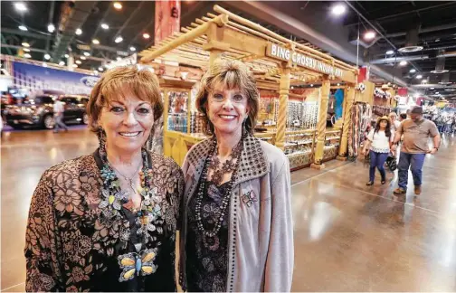  ?? Steve Gonzales / Houston Chronicle ?? Bing Crosby Indian Art general manager Carol Yeager Berger, left, and owner Vickie Crosby share a moment together at their last Houston rodeo.