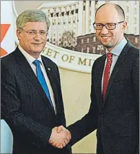  ?? SEAN KILPATRICK/THE CANADIAN PRESS ?? Prime Minister Stephen Harper shakes hands with Ukrainian Prime Minister Arseniy Yatsenyuk following a joint press conference in this file photo from Saturday, March 22, 2014.