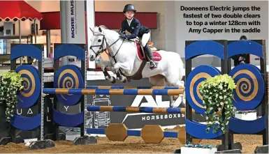  ?? ?? Dooneens Electric jumps the fastest of two double clears to top a winter 128cm with Amy Capper in the saddle