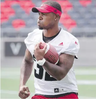  ?? WAYNE CUDDINGTON ?? Nic Grigsby carries the ball as the Ottawa Redblacks run a walkthroug­h practice in advance of their CFL game against the Calgary Stampeders on Friday night, where Grigsby will make his season debut.