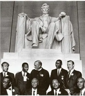  ?? National Archives ?? Rep. John Lewis, back row, second from left, and other civil rights leaders gathered in front of the Lincoln Memorial during the March on Washington in 1963.