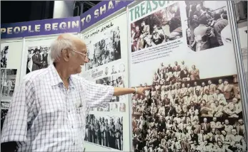  ??  ?? Volunteer and senior guide Sonny Singh at the ‘South Africa in the Making’ exhibition centre at Moses Mabhida Stadium points to the picture of Monty Naicker who is seen among the Rivonia Treason Triallists of 1961.