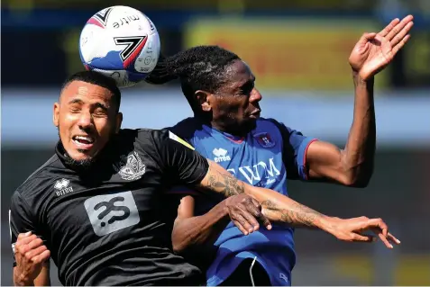  ?? Pictures: Getty Images ?? HEADS UP: Port Vale’s Cristian Montano and Carlisle’s Omari Patrick do battle in Saturday’s match.