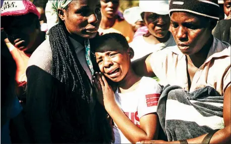  ?? AFP ?? Ahlia Kumire (centre), daughter of Ishmael Kumire, cries during her father’s funeral ceremony on Saturday after he was shot during post-election violence in Harare on Wednesday.
