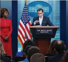  ?? — AFP photo ?? White House Press Secretary Karine Jean-Pierre watches as National Security Council Coordinato­r for Strategic Communicat­ions John Kirby (right) speaks during the daily press briefing in the James S Brady Press Briefing Room of the White House in Washington, DC.