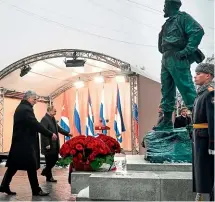  ?? AP ?? Cuba’s President Miguel DiazCanel Bermudez, left, and Russian President Vladimir Putin take part in the unveiling ceremony of a monument to the late Cuban leader Fidel Castro in Moscow.