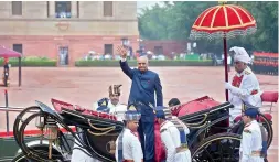  ??  ?? Newly sworn-in President Ram Nath Kovind leaves in a regal buggy after inspecting a guard of honour in the forecourt of the Rashtrapat­i Bhavan on Tuesday.