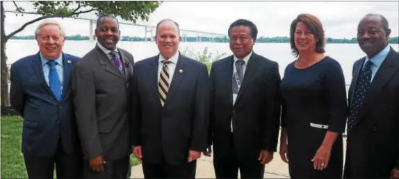  ??  ?? Delaware County Council Vice Chair Colleen Morrone and Councilman John McBlain joined city and state officials to welcome Chum Bunrong, Cambodian Ambassador to the United States and Mexico, to Delaware County at reception held July 26 the Wharf...