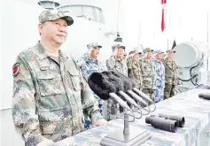  ?? — Reuters photo ?? Xi delivers a speech as he reviews a military display of Chinese People’s Liberation Army (PLA) Navy in the South China Sea.