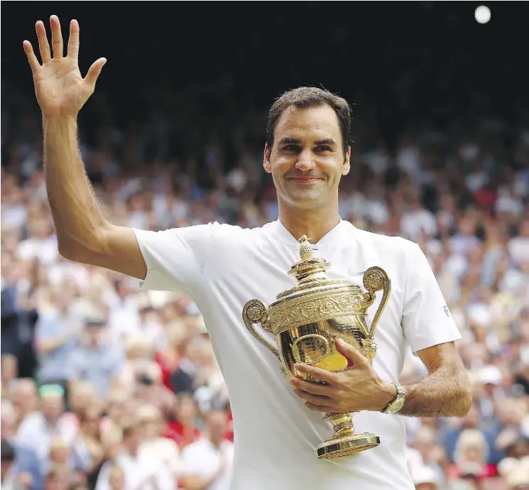  ?? CLIVE BRUNSKILL/GETTY IMAGES ?? Roger Federer celebrates after winning the Wimbledon men’s singles final on Sunday in London. The win gave Federer his eighth Wimbledon title.