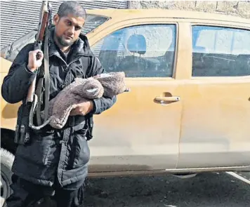  ??  ?? Siddhartha Dhar, also known as Abu Rumasayah, and nicknamed ‘Jihadi Sid’, posted this picture of himself and his baby son on Twitter