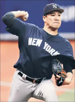  ?? AP ?? BEAT THE HEAT: Masahiro Tanaka, throwing a bullpen session in Toronto in June, has allowed home runs at a higher rate than last year, due in part to a lack of command on his fastball.