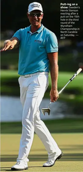  ??  ?? Putt-ing on ashow: Sweden’s Henrik Stenson reacting after a putt on the 15th hole in the third round of the Wyndham Championsh­ip in North Carolina on Saturday. — AFP