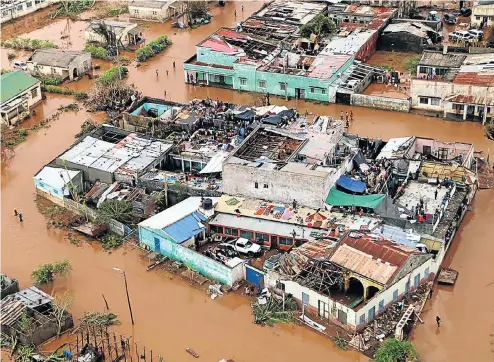  ?? Picture: AFP ?? Shattered homes in Beira appear to float like boats in the floodwater­s from Cyclone Idai which devastated the city and towns in northern Mozambique two weeks ago.