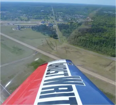  ?? (Photo by Charlie Benton, SDN) ?? Looking down at Columbus Air Force Base following takeoff in GhostWrite­r, a modified 1956 deHavillan­d Chipmunk flown as an aerobatic plane and skywriter by Nathan K. Hammond.