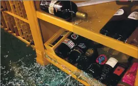  ?? COURTESY OF BERT GEORGE ?? A display cabinet was smashed and rare wines were stolen from Joseph George Wines at 1559 Meridian Ave. in San Jose after a weekend burglary.