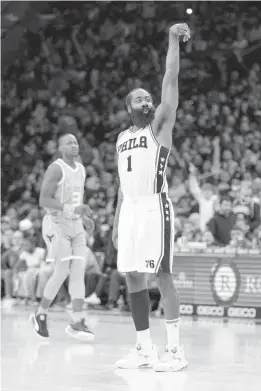  ?? CHRIS SZAGOLA/AP ?? Philadelph­ia 76ers’ James Harden reacts to his basket during the second half against the Charlotte Hornets on Saturday in Philadelph­ia. The 76ers won 144-114.