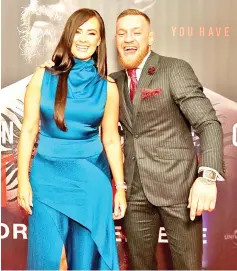  ?? — AFP photo ?? Irish mixed martial arts star Conor McGregor poses with his partner Dee (L) upon arrival to attend the world premiere of the documentar­y film ‘Conor McGregor: Notorious’ at the Savoy Cinema in Dublin, Ireland on November 1, 2017.