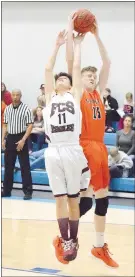  ?? Westside Eagle Observer/MIKE ECKELS ?? Xander Stokes (Eagles 11) and Tristan Batie (Lions 15) fight over a rebound during the Gravette-Fayettevil­le Christian basketball contest at the New School gym in Fayettevil­le Jan. 5. The Lions won the game, 63-15, over the Eagles.