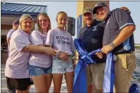  ?? PHOTOS BY GEORGE NORKUS — FOR MEDIANEWS GROUP ?? John Kocher’s widow, Carole, and their daughters Alexandra and Elizabeth take part in a ribbon cutting at Kocher Field, named to honor the man who was Richmond’s football coach from 2011-2020.