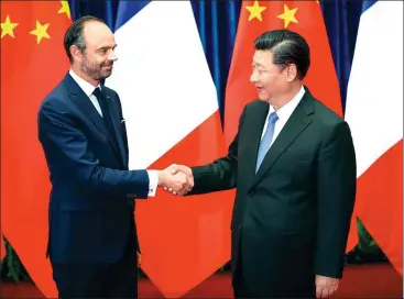  ?? FENG YONGBIN / CHINA DAILY ?? President Xi Jinping meets French Prime Minister Edouard Philippe at the Great Hall of the People in Beijing on Monday. Xi said China appreciate­s France’s proactive participat­ion in building the Belt and Road.