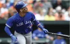  ?? GAIL BURTON/THE ASSOCIATED PRESS ?? Devon Travis watches Sunday’s three-run homer, all the Blue Jays would need in a 3-1 victory over the Orioles. Next stop, Milwaukee.