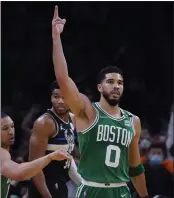  ?? CHARLES KRUPA — THE ASSOCIATED PRESS ?? Celtics forward Jayson Tatum, who had 19points, celebrates after a basket against the Bucks in Game 2.