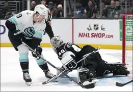  ?? MARK J. TERRILL — THE ASSOCIATED PRESS ?? Kings goalie Cal Petersen sprawls to make a save on Seattle's Ryan Donato on Tuesday.