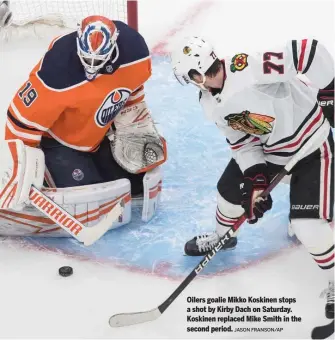  ?? JASON FRANSON/AP ?? Oilers goalie Mikko Koskinen stops a shot by Kirby Dach on Saturday. Koskinen replaced Mike Smith in the second period.