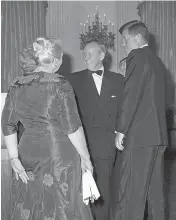  ?? BYRON ROLLINS / THE ASSOCIATED PRESS FILES ?? President John F. Kennedy and Lester Pearson, leader of Canada’s Liberal Party, talk before a Nobel Prize gala at the White House in the spring of 1962. Then-Canadian prime minister John Diefenbake­r was said to be enraged Pearson was invited instead of...