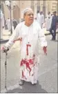 ??  ?? A man in a blood-soaked clothes at the Shia mosque in Kuwait City on Friday.
