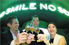  ?? ?? (From left) lee, Edrington Malaysia country manager Ken lam and marketing manager Kiki loo with glasses of amber Meadow whisky to show its summer evening hue. — lim BENG TATT/THE Star
