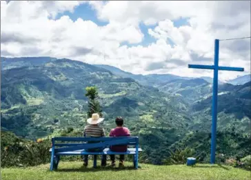  ?? FEDERICO RIOS ESCOBAR/THE NEW YORK TIMES ?? The scenic view from a hillside home in Jardín, Colombia, on November 17. The hillsides abound with coffee bushes around the village of Jardín, in the Andes mountains of Colombia, where the bean is central to life and culture.