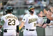  ?? BRANDON VALLANCE — GETTY IMAGES ?? The A's Seth Brown (15) celebrates after scoring a run in the sixth inning against the Astros at the Coliseum on Saturday in Oakland.