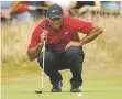  ?? PETER MORRISON/ASSOCIATED PRESS ?? Tiger Woods lines up a putt on the fourth green during the final round of the British Open on Sunday in Carnoustie, Scotland.