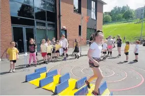  ??  ?? Sports day Pupils overcame some hurdles in what was a successful day of activities