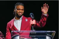  ?? The Associated Press ?? Buffalo Bills’ Damar Hamlin waves after being introduced as the winner of the Alan Page Community Award during a news conference ahead of Super Bowl 57 Wednesday in Phoenix.