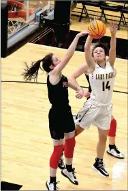  ?? ENTERPRISE-LEADER photograph by Mark Humphrey ?? A pair of Lady Blackhawk defenders team up to block a shot attempt by Prairie Grove sophomore Trinity Dobbs during the Lady Blackhawks’ 48-26 win at Tiger Arena in a reschedule­d game played Monday, Jan. 13.